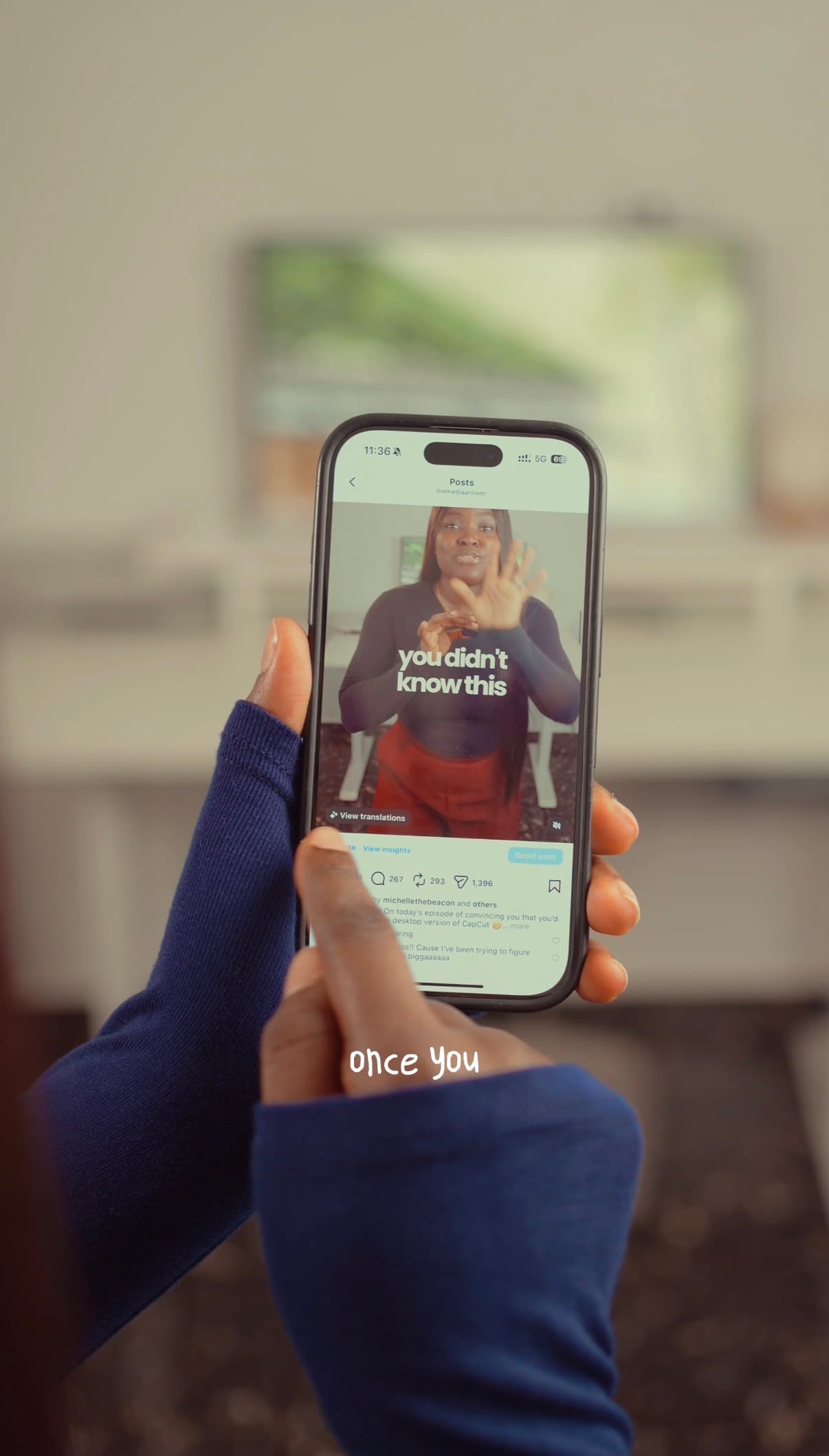 Hands holding a smartphone showing a social media video with text "you didn't know this".